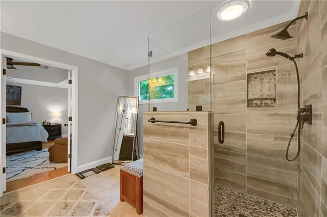 a bedroom with furniture and a window