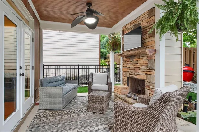 a view of backyard of house with outdoor seating
