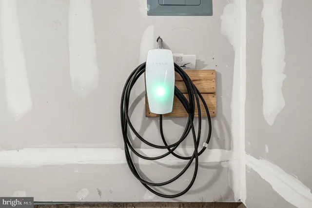 a bathroom with a mirror and bathtub