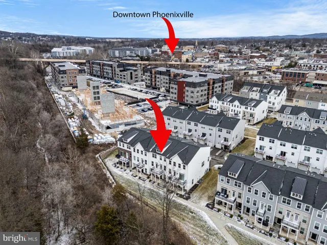 an aerial view of residential houses with outdoor space