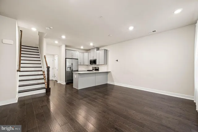a view of kitchen with wooden floor