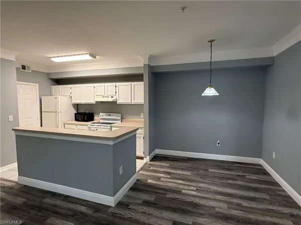 a view of kitchen with stainless steel appliances granite countertop a sink and a stove