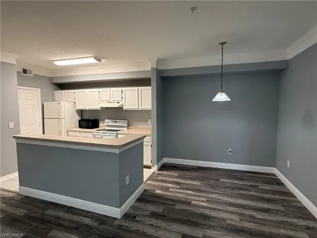 a view of kitchen with stainless steel appliances granite countertop a sink and a stove