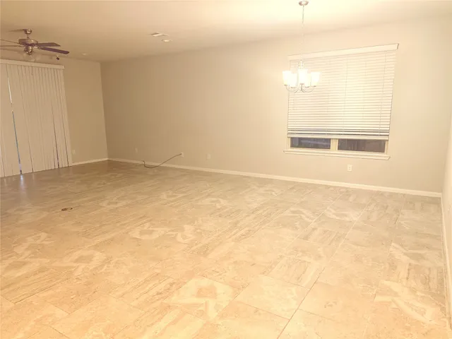 an empty room with a windows