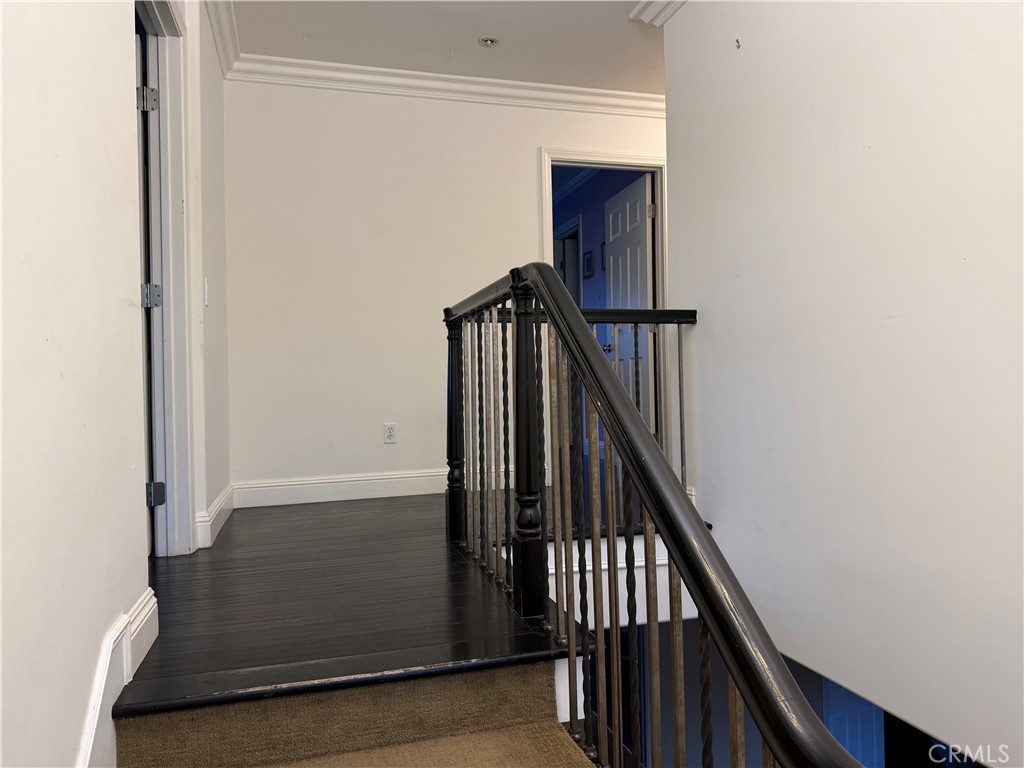 32044 Cypress Way Castaic, CA 91384 - Photo 29 of 59 a view of staircase with wooden floor and white walls
