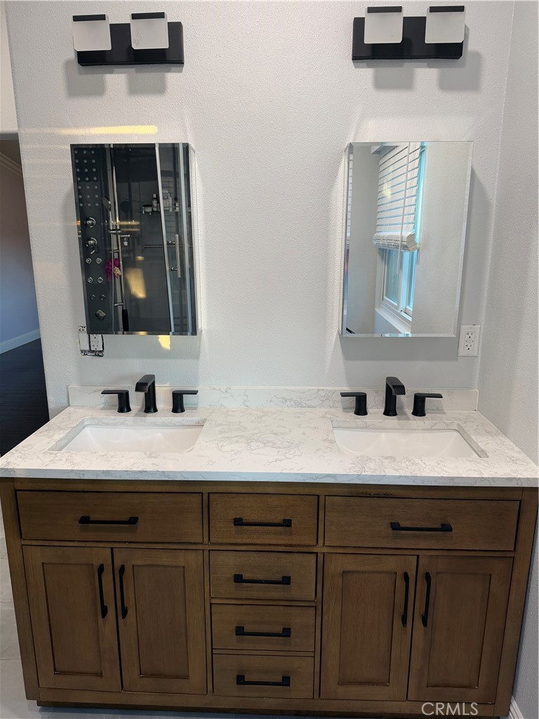 32044 Cypress Way Castaic, CA 91384 - Photo 39 of 59 a bathroom with a sink and a mirror