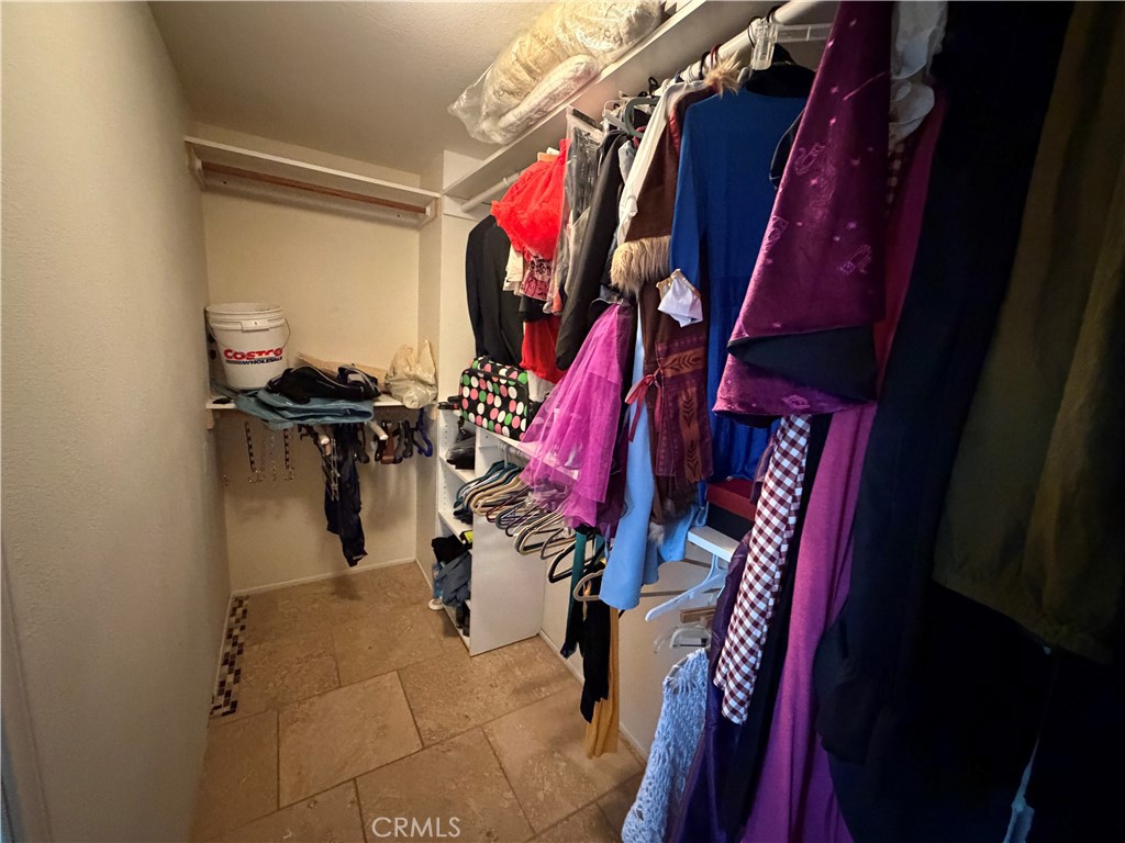 32044 Cypress Way Castaic, CA 91384 - Photo 43 of 59 a view of walk in closet with clothes
