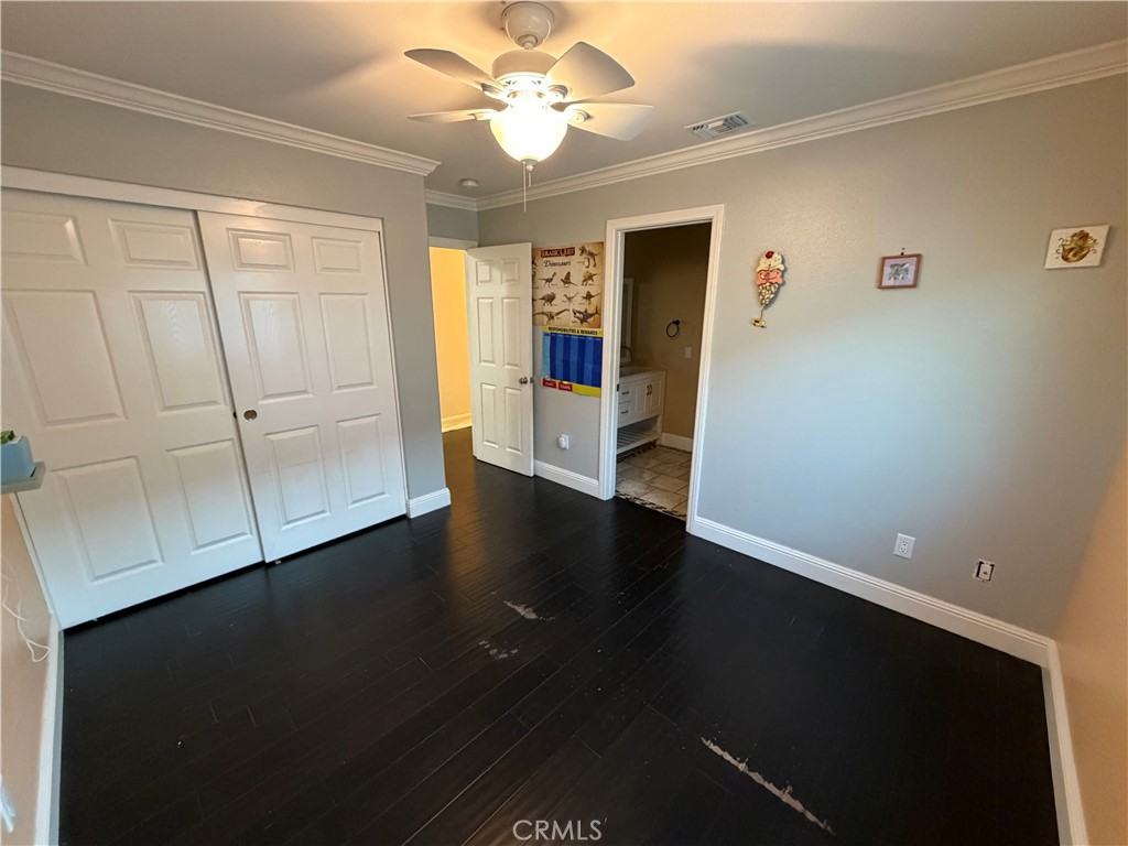 32044 Cypress Way Castaic, CA 91384 - Photo 52 of 59 a view of an empty room with wooden floor and a window