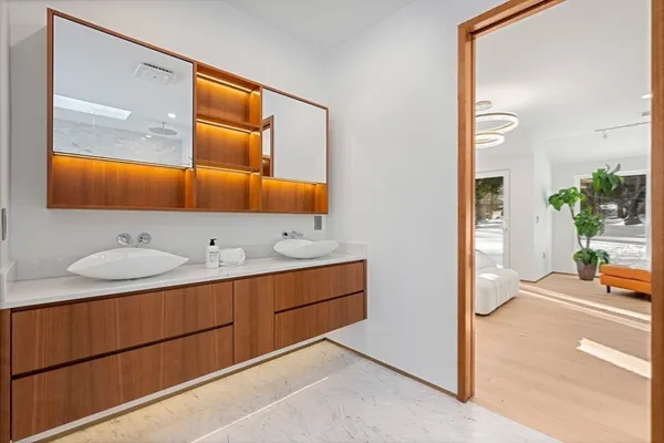 a bathroom with a sink and a mirror