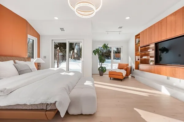 a bedroom with a bed and glass window