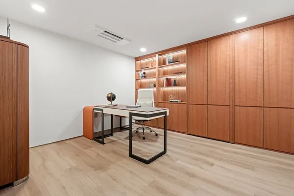 a view of a workspace with furniture
