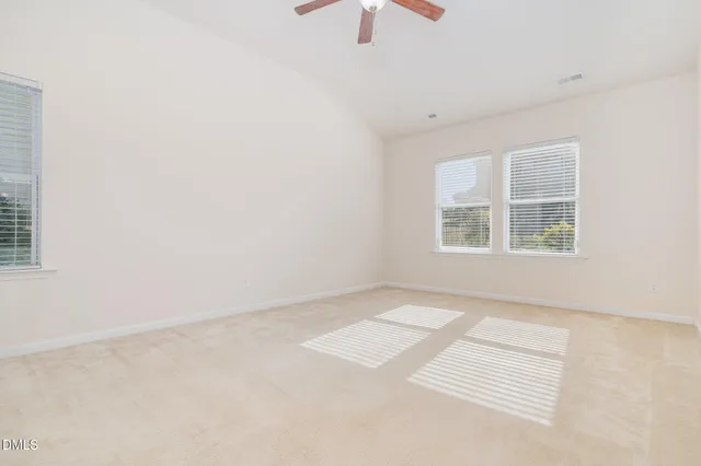 a room with a dresser and mirror