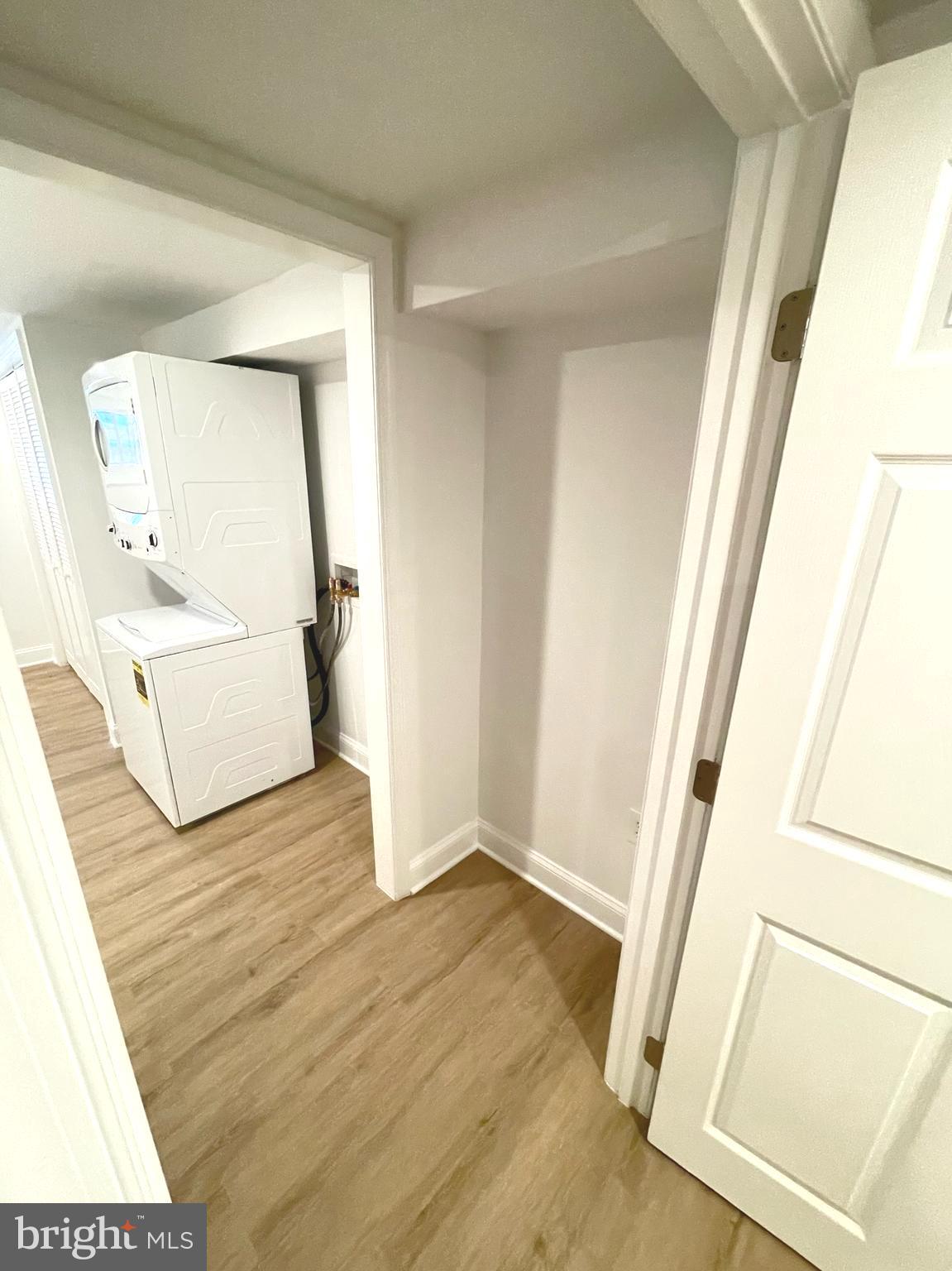 1718 Lang Place Northeast Washington, DC 20002 - Photo 22 of 32 a view of front door with chair and wooden floor