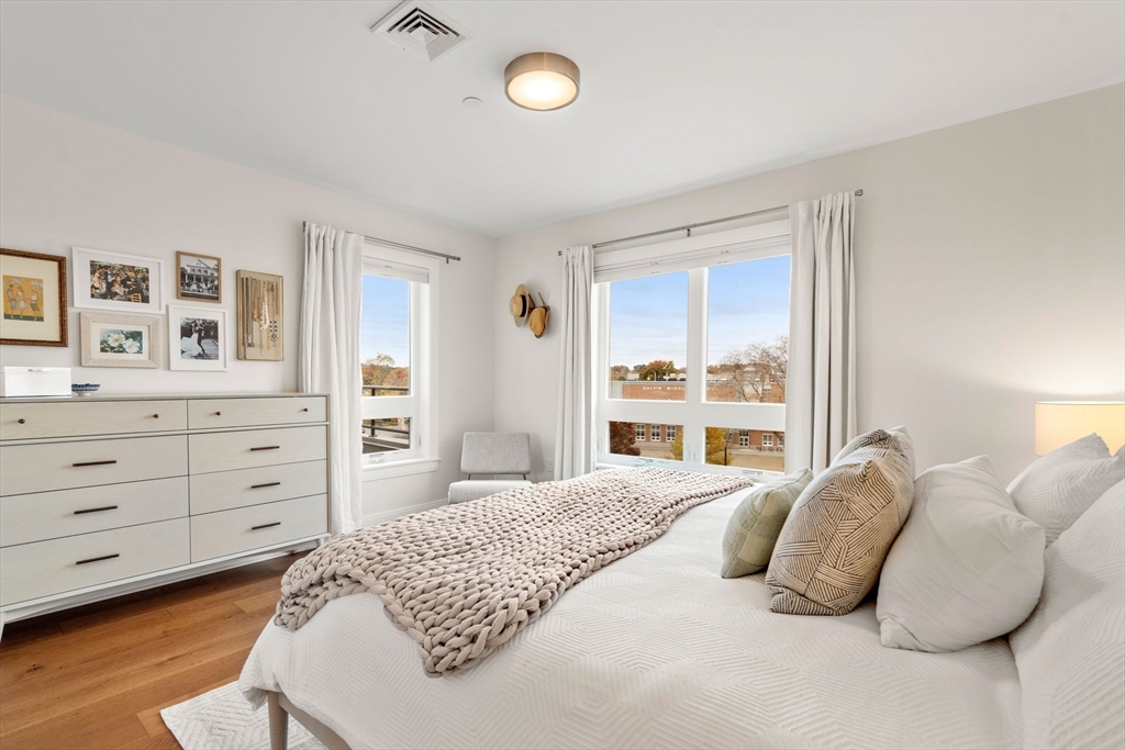 3 Bennett Street, Unit 402 Wakefield, MA 01880 - Photo 14 of 23 a bedroom with a bed and window