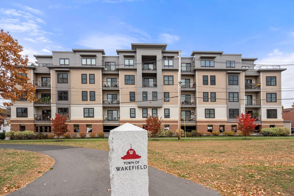 3 Bennett Street, Unit 402 Wakefield, MA 01880 - Photo 21 of 23 a front view of a building with street view