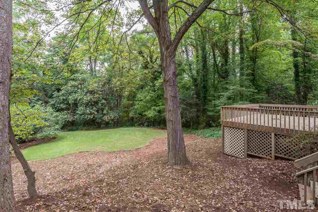 2276 The Circle Raleigh, NC 27608 - Photo 22 of 25 a view of a yard in a backyard
