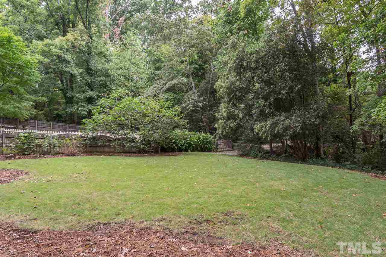 2276 The Circle Raleigh, NC 27608 - Photo 23 of 25 a view of a field with a tree