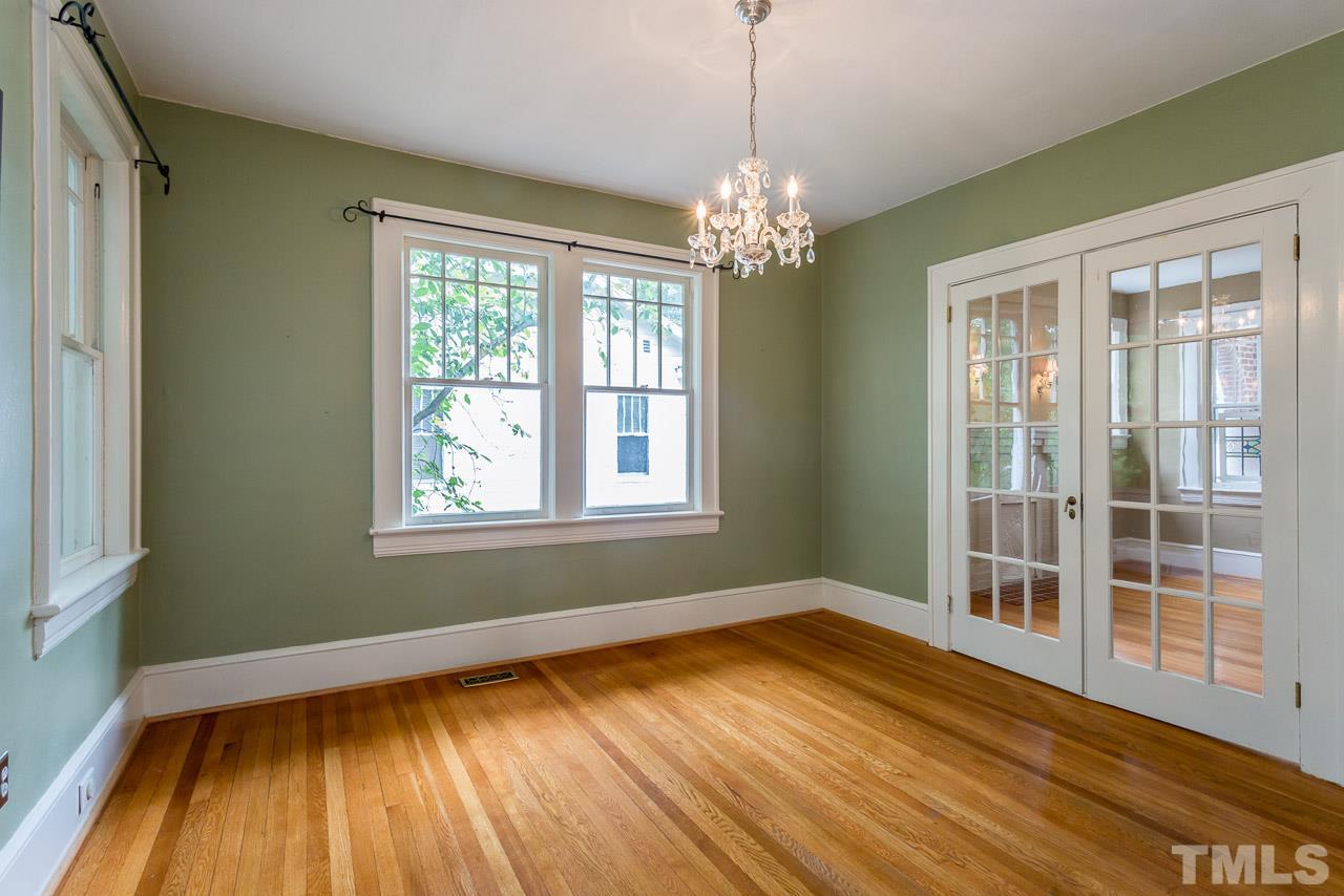2276 The Circle Raleigh, NC 27608 - Photo 3 of 25 a view of empty room with wooden floor and fan