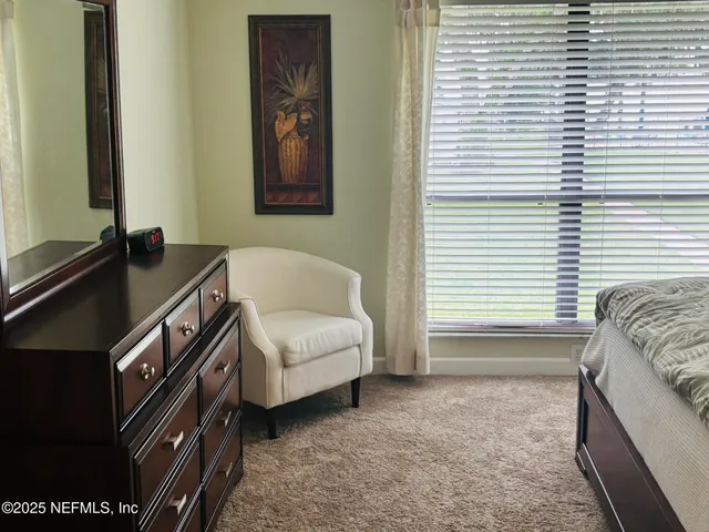 a swimming pool with outdoor seating and yard