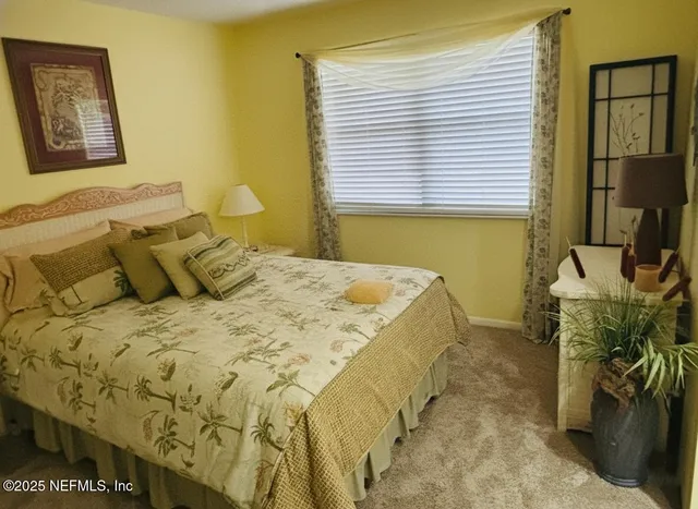 a bathroom with a granite countertop sink mirror vanity and a bathtub
