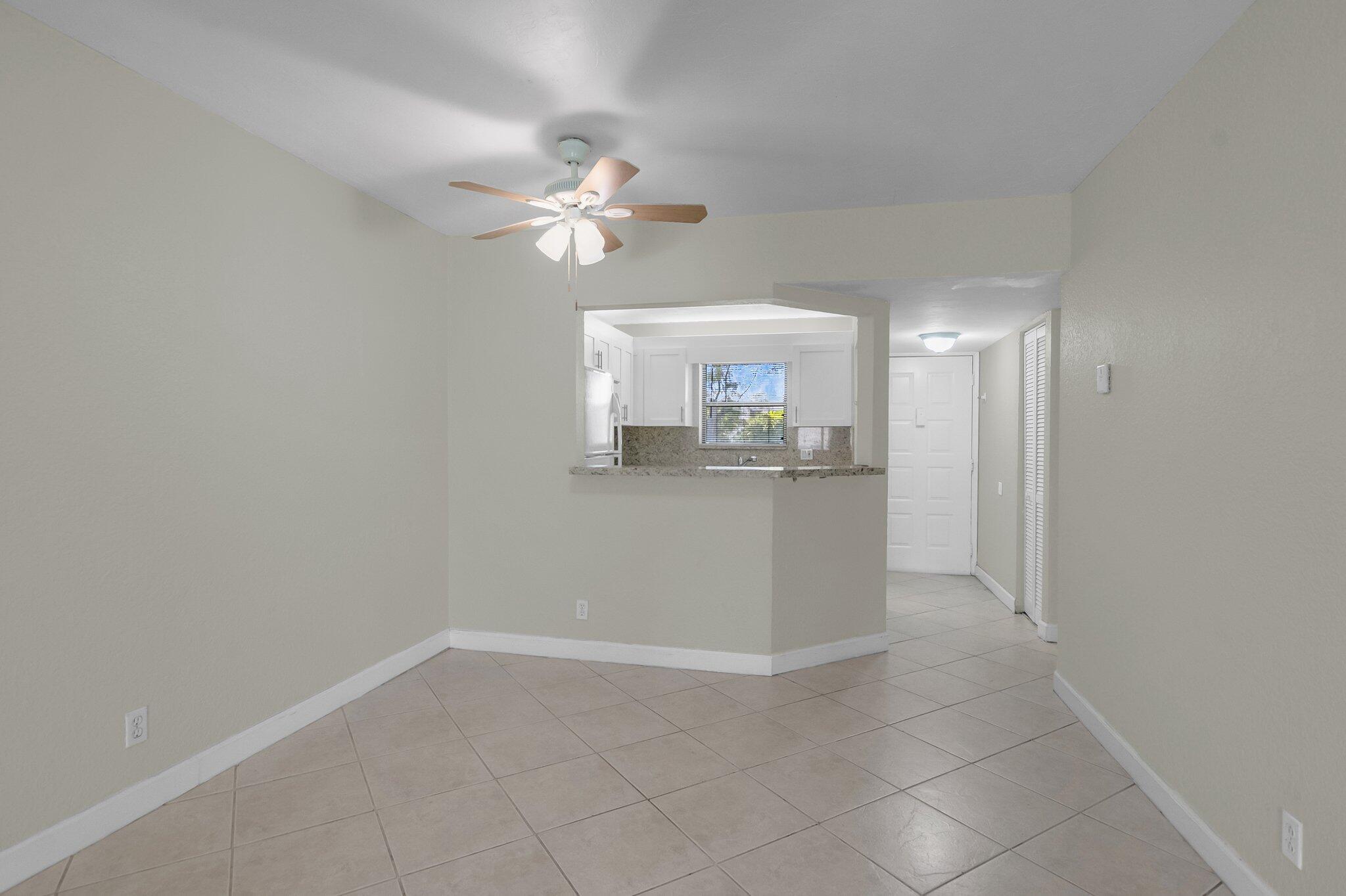 21911 Lake Forest Circle, Unit 103 Boca Raton, FL 33433 - Photo 10 of 24 Dining onto kitchen view 2
