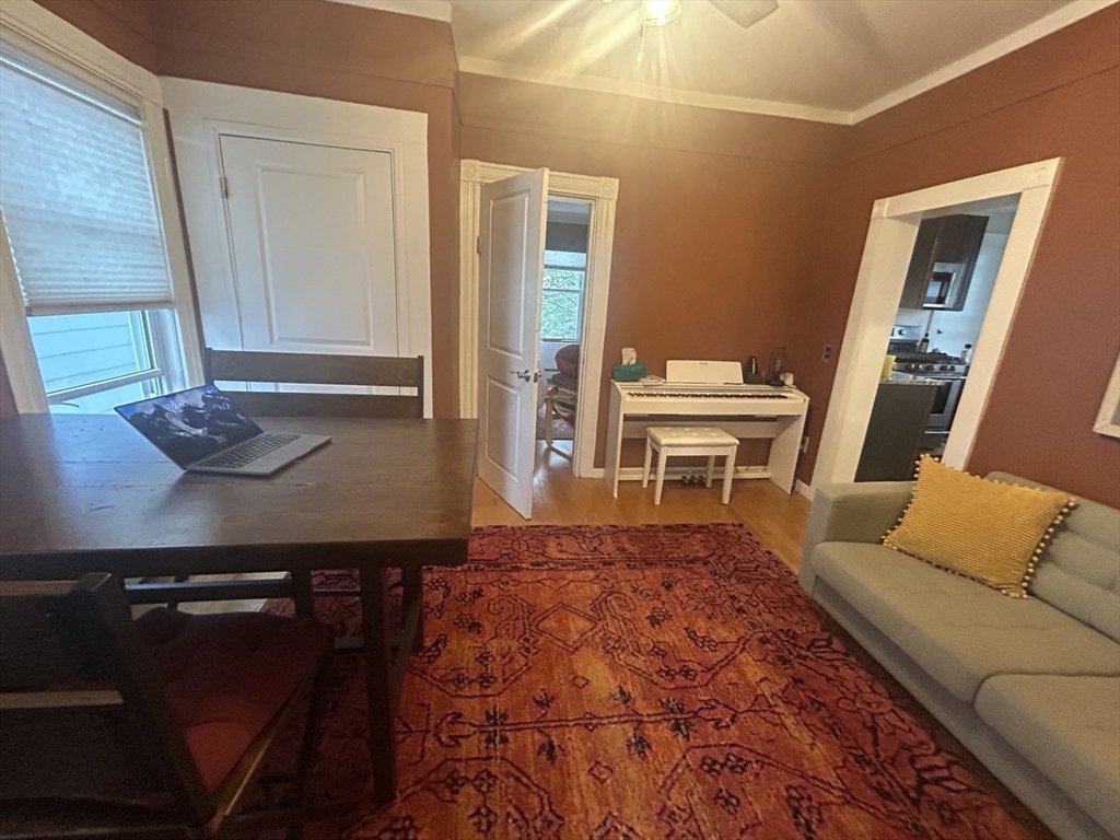 12 Pearl St Place, Unit 3 Somerville, MA 02145 - Photo 6 of 12 a living room with furniture and a couch