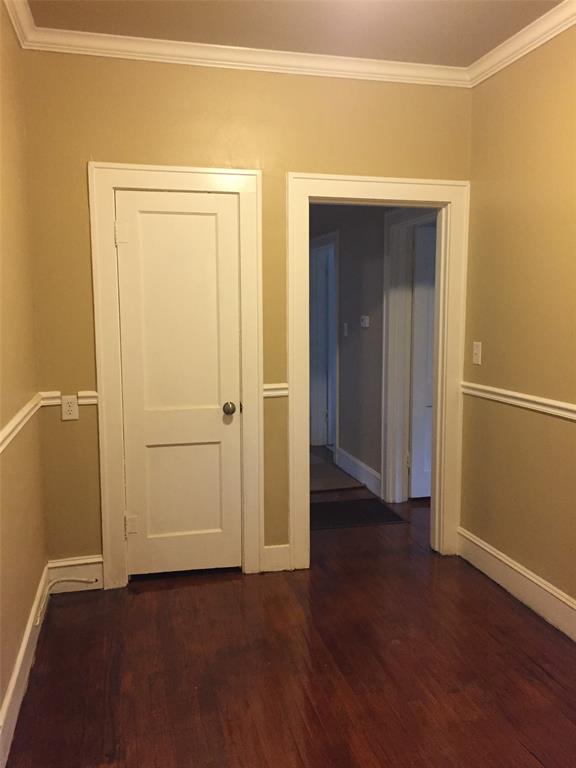 313 Merrick Street Shreveport, LA 71104 - Photo 13 of 18 an empty room with wooden floor and closet