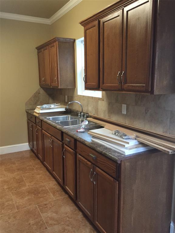313 Merrick Street Shreveport, LA 71104 - Photo 14 of 18 a kitchen with stainless steel appliances granite countertop a sink stove and cabinets