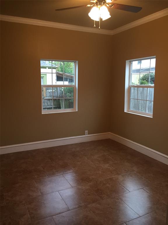 313 Merrick Street Shreveport, LA 71104 - Photo 18 of 18 an empty room with windows and fan