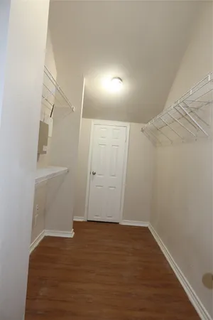a kitchen with stainless steel appliances a refrigerator and a stove top oven