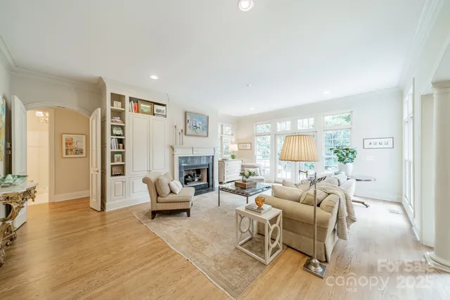 a living room with furniture or couch and a fireplace