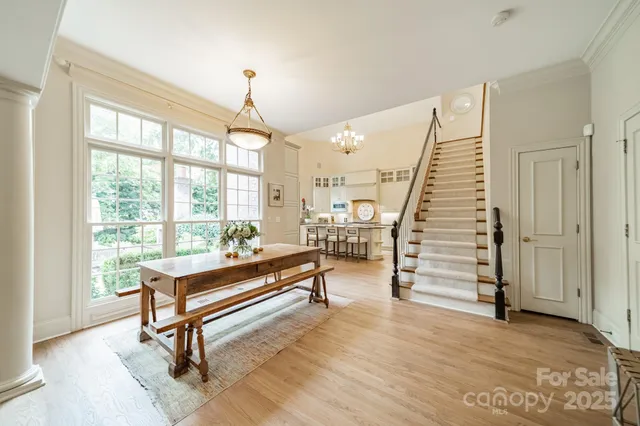 a large white kitchen with a large window