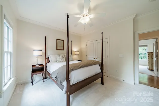 a en suite bathroom with a double vanity sink and a mirror