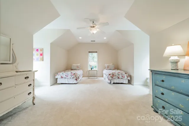 a bedroom with furniture and a chandelier