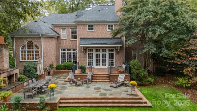 a backyard of a house with seating space and yard