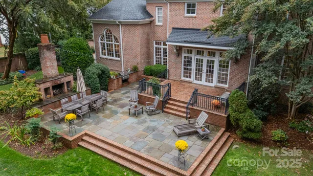 a view of a house with backyard sitting area and garden