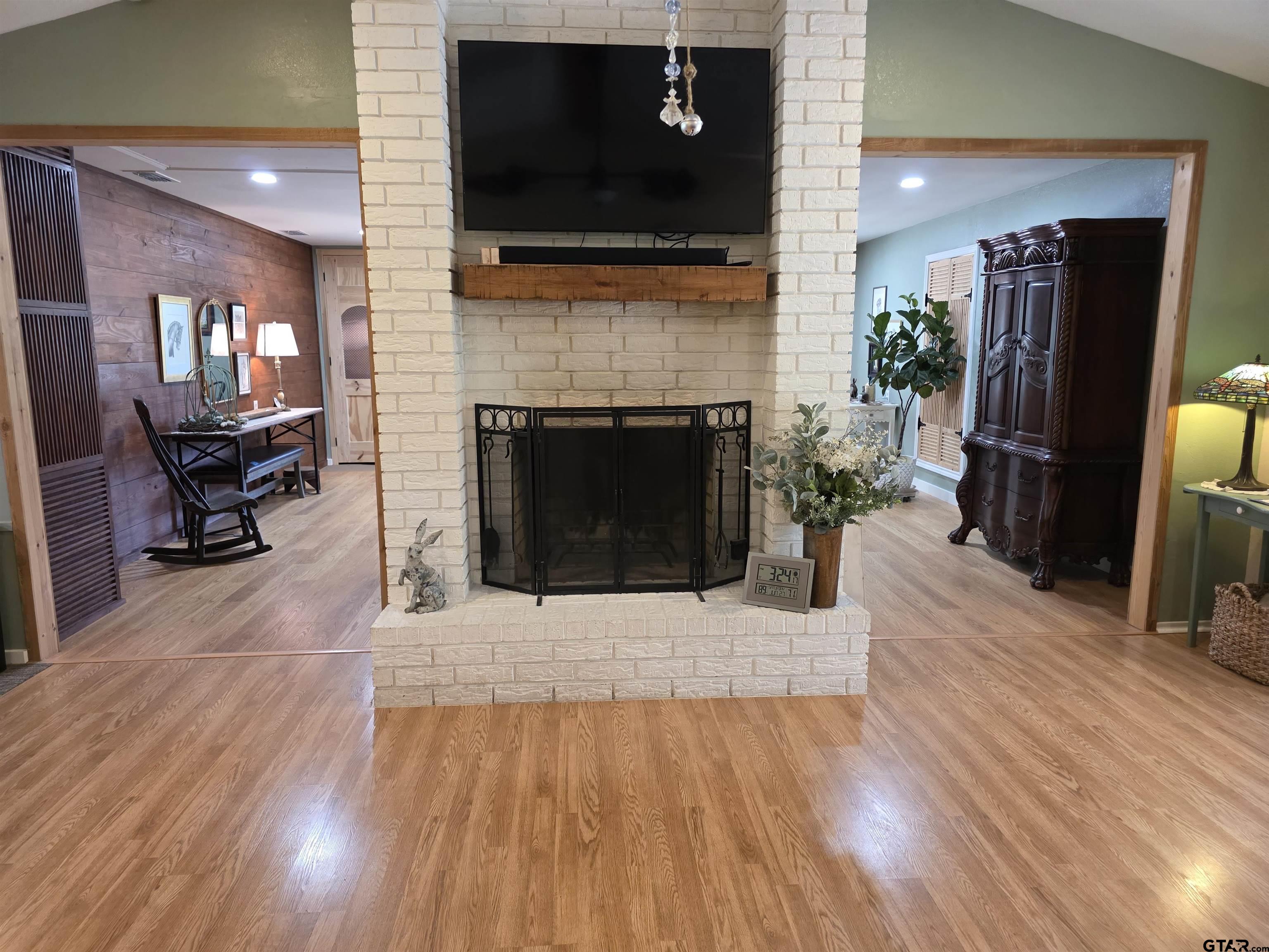 6170 Highway 271 Mount Pleasant, TX 75455 - Photo 14 of 43 a living room with furniture and a fireplace or television