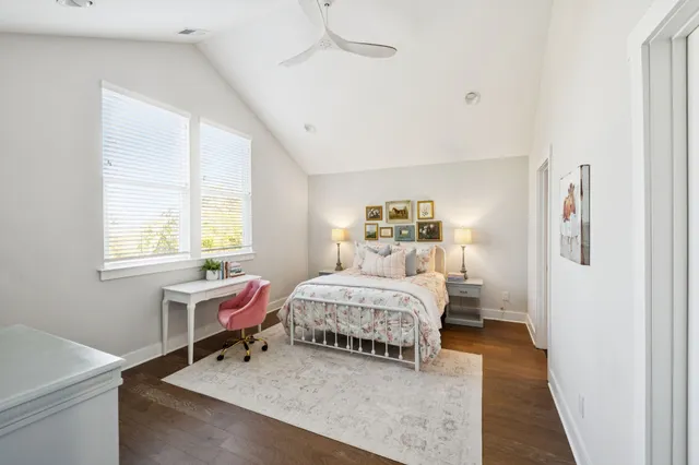 a bedroom with a bed and a table in it