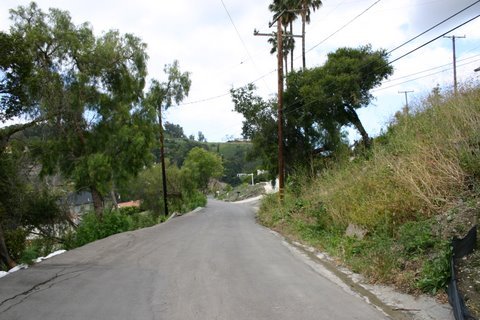 438 Conejo Road Santa Barbara, CA 93103 - Photo 6 of 13 a view of a road with a yard and mountain view