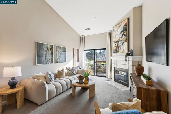 a bedroom with furniture and a flat screen tv