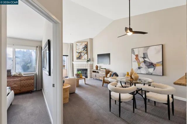 a living room with furniture and a flat tv screen