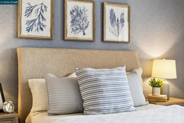 a bedroom with a bed and a couch