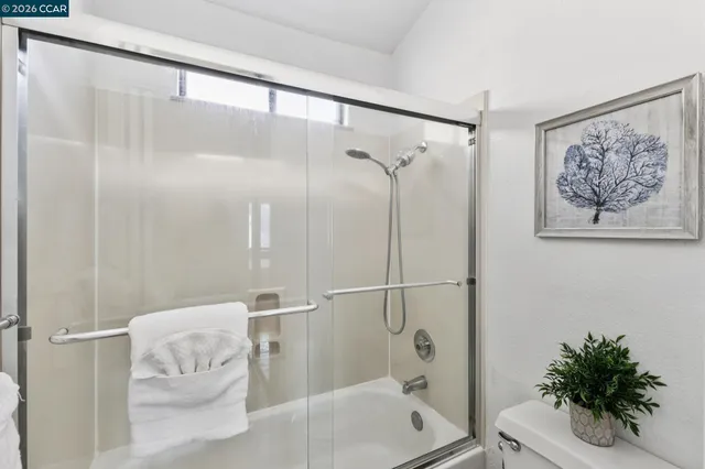 a bathroom with a shower and a tub