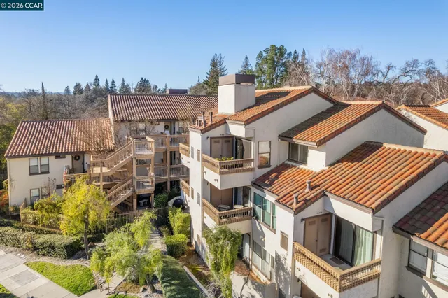 a aerial view of a house with a yard
