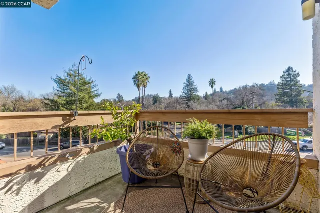 an outdoor view with swimming pool and seating