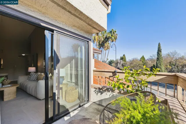 a view of an chairs and table in the balcony
