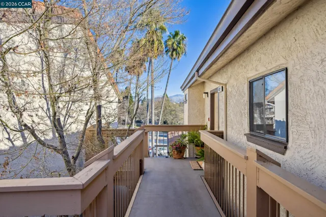 a view of balcony and wooden
