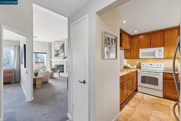 a kitchen with a stove and a refrigerator
