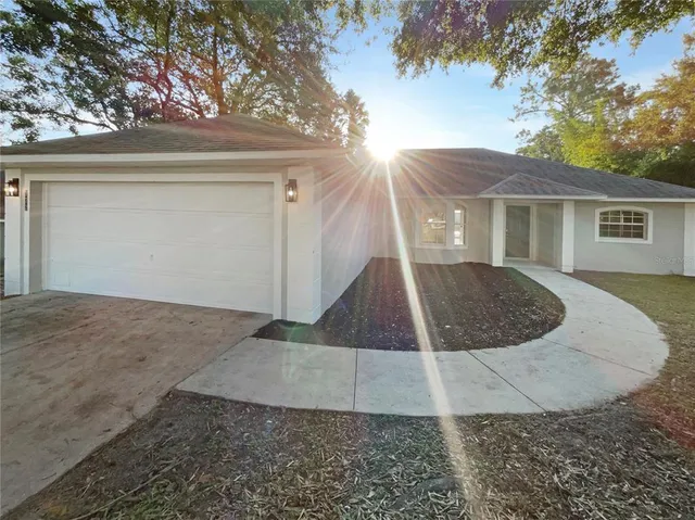 a view of empty room with a fireplace