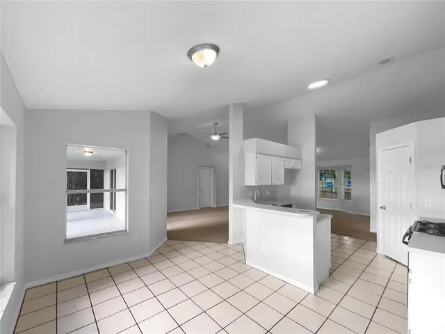 a kitchen with stainless steel appliances a refrigerator and a stove top oven